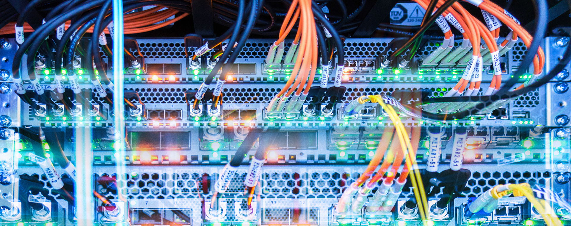 Modern office building exterior with glass curtain wall design, reflecting blue sky and clouds under sunlight, demonstrating professional image of technology company